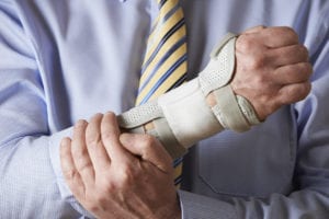 Businessman Suffering With Wrist Pain