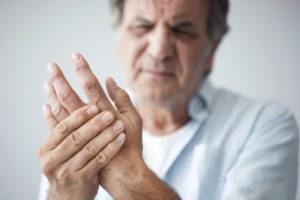 Man suffering with hand pain