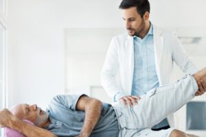 Doctor Checking the Hip Arthritis of old Patient