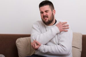 Man suffering with elbow pain