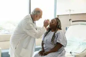 senior doctor checks mature woman for concussion Signs & Symptoms