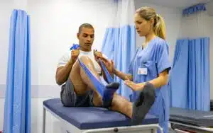 Patient doing physical therapy exercises in ACL Surgery Rehabilitation